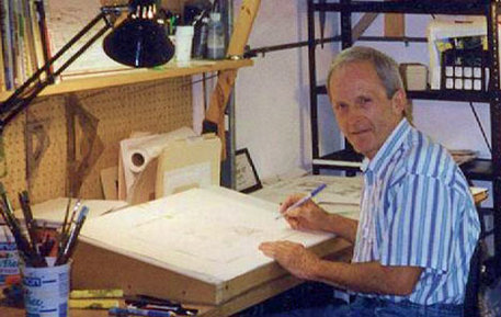 Bill Monroe Cartoonist  in his cluttered yet functional studio.